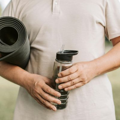 Close-up of a yoga mat and water bottle.